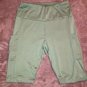 A stretchy workout feel to these camp colored biker shorts. Two side pockets.